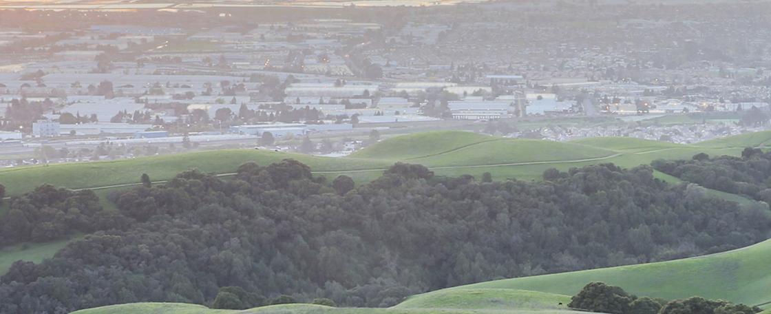 Birds view of rolling hills and city view. 