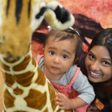Mom and daughter with plush giraffe 