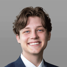 Headshot of a man smiling.