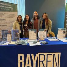 BayREN members sharing program information at a conference.